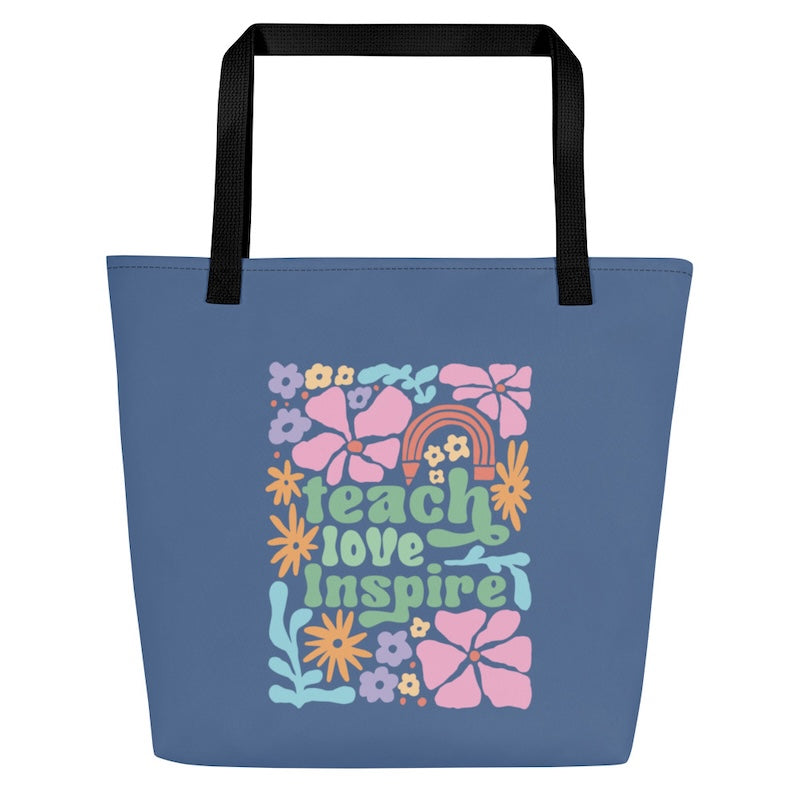 Blue tote bag with colorful floral design and text on a white background