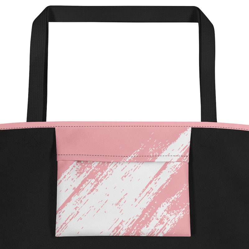 Black tote bag with pink and white abstract pattern on a white background