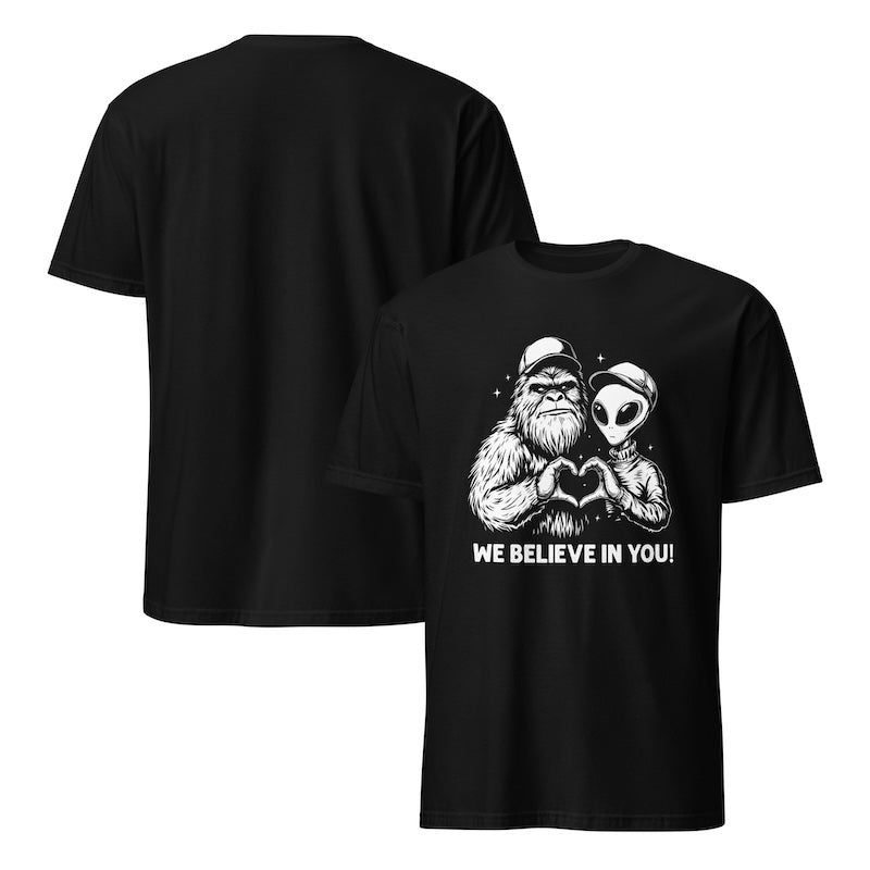Black t-shirt with a graphic of a Sasquatch and alien holding hands and 'WE BELIEVE IN YOU!' text, shown from front and back.