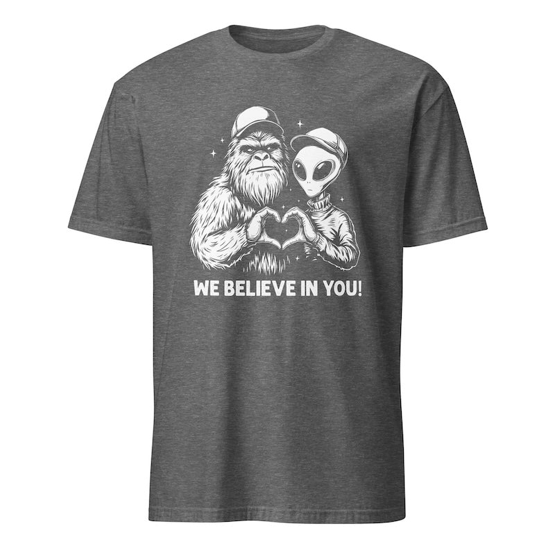 Gray t-shirt with a graphic of a gorilla and alien holding hands and 'WE BELIEVE IN YOU!' text on a white background.