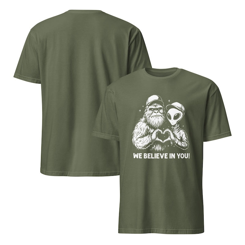 Green t-shirt with a graphic of a Sasquatch and alien holding hands and 'We Believe In You!' text, shown from front and back.