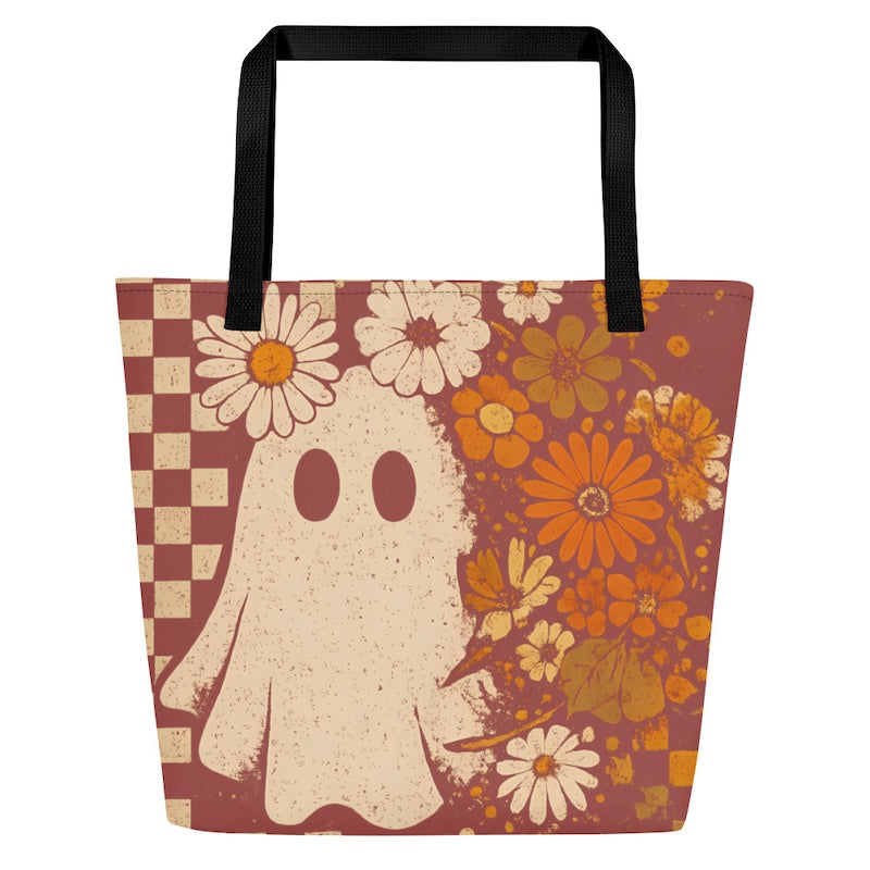 Tote bag with ghost and floral design on a white background