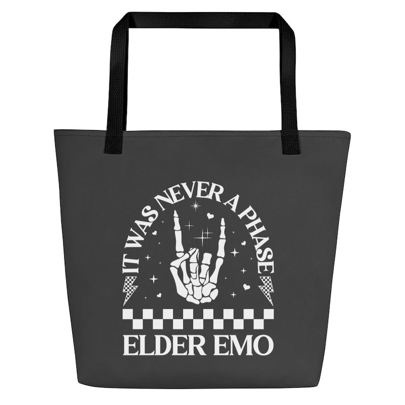 Black tote bag with white text and design on a white background