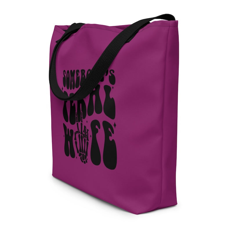 Purple tote bag with black text and design on a white background