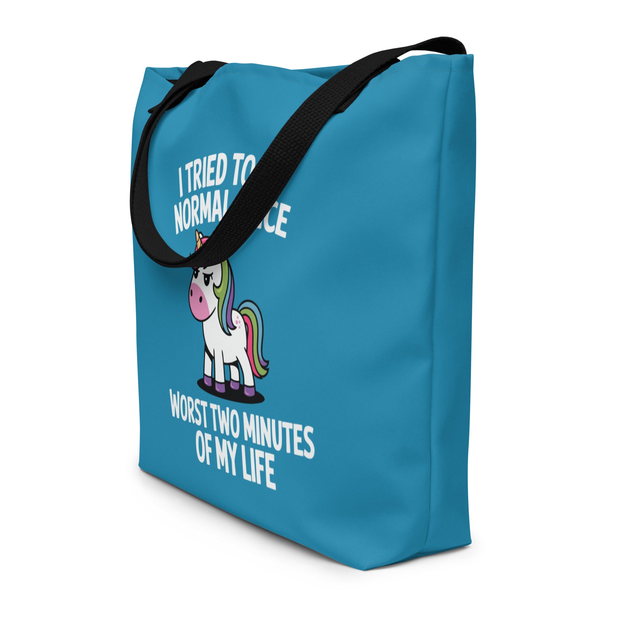 Blue tote bag with a unicorn graphic and text on a white background