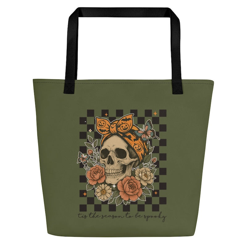 Green tote bag with a skull and floral design on a checkered background