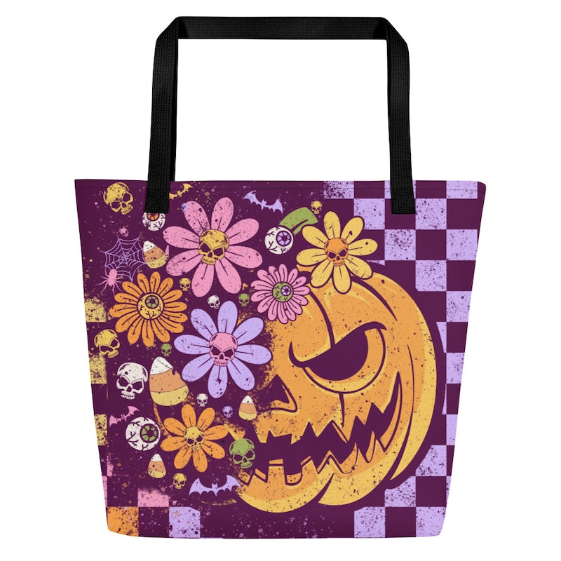 Tote bag with Halloween-themed design featuring pumpkins, flowers, and checkered pattern on a purple background.