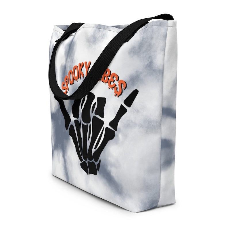 Tote bag with skeleton hand and 'Spooky Vibes' text on a white background