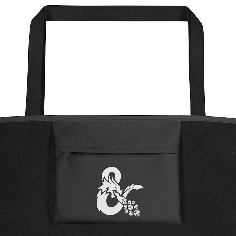 Black tote bag with a white logo featuring a dragon and ampersand on a white background