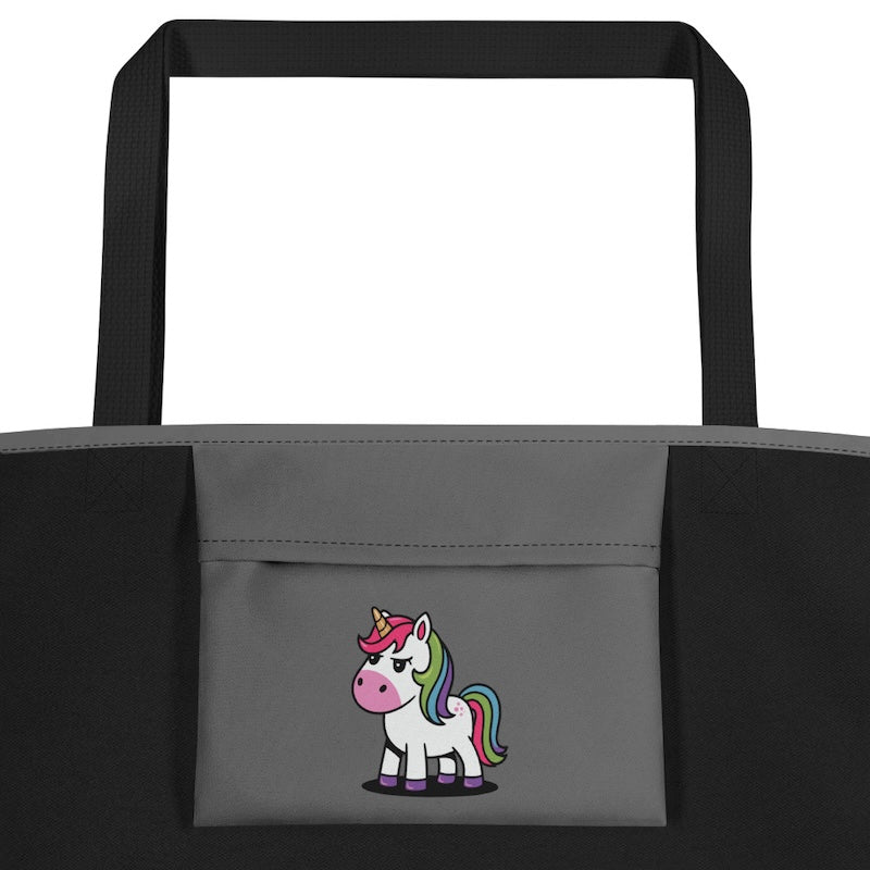 Gray tote bag with a cartoon unicorn design on a white background