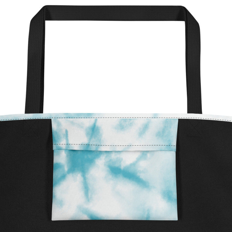Tote bag with black handle and tie-dye pattern on a white background
