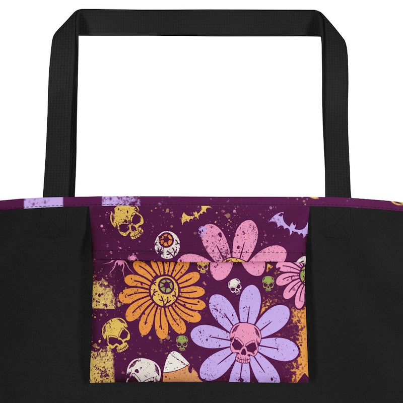 Tote bag with colorful floral and skull design on a purple background