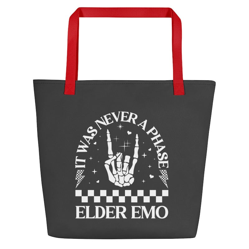 Black tote bag with red handles featuring a hand gesture and text on a white background