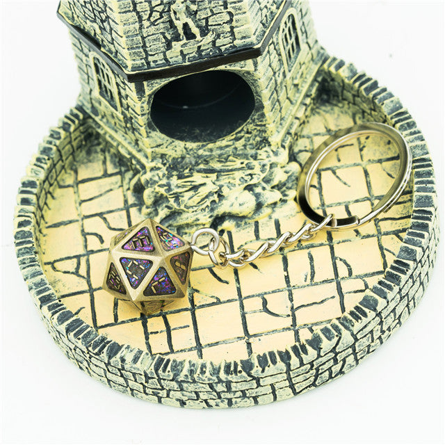 Keychain with a dice design on a decorative stone surface
