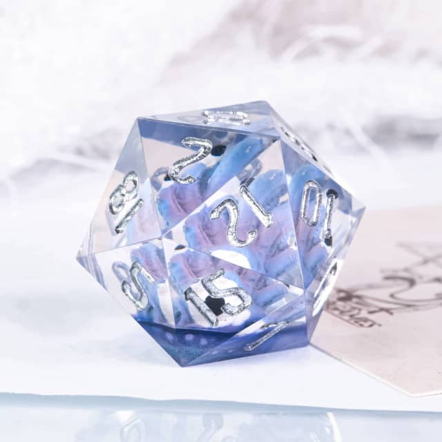 Translucent blue polyhedral dice with white numbers on a light gray background