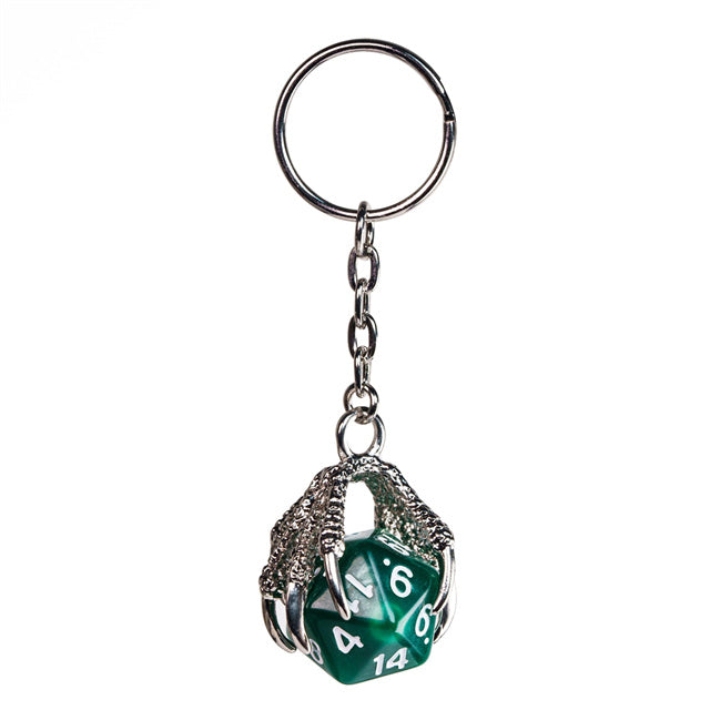 Green polyhedral die keychain with metal cage on a white background
