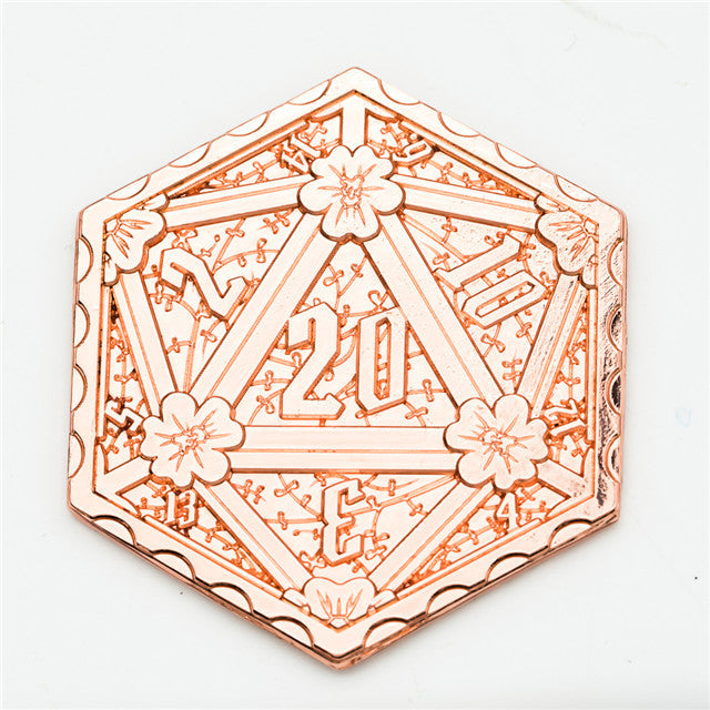 Decorative hexagonal object with floral designs and text on a white background