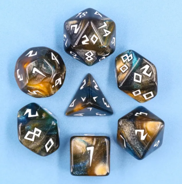 Set of polyhedral dice with metallic sheen on a light blue background