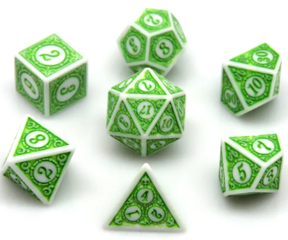 Set of green and white polyhedral dice on a white background