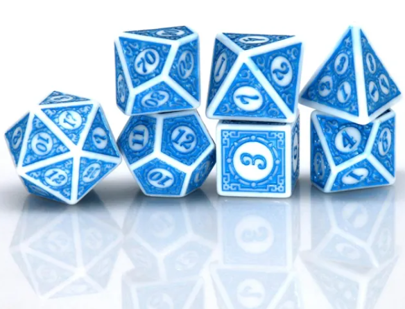 Set of blue polyhedral dice with white numbers on a reflective surface