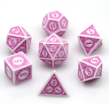 Set of pink and white polyhedral dice on a white background