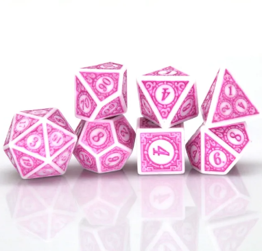 Set of pink polyhedral dice on a white background