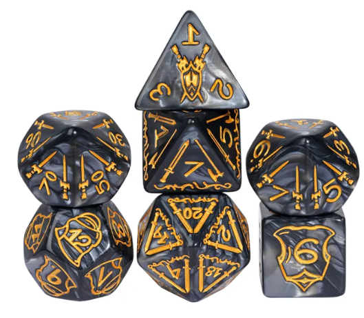 Set of black and gold polyhedral dice with intricate designs on a white background