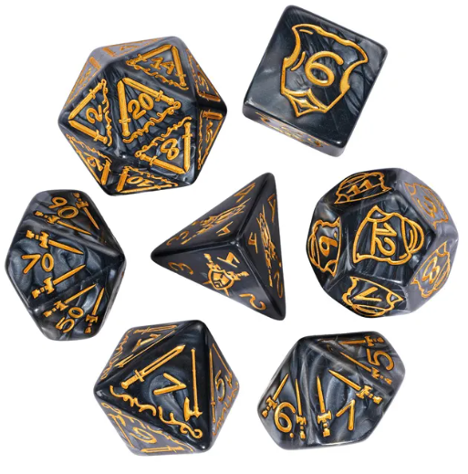 Set of black and gold polyhedral dice on a white background