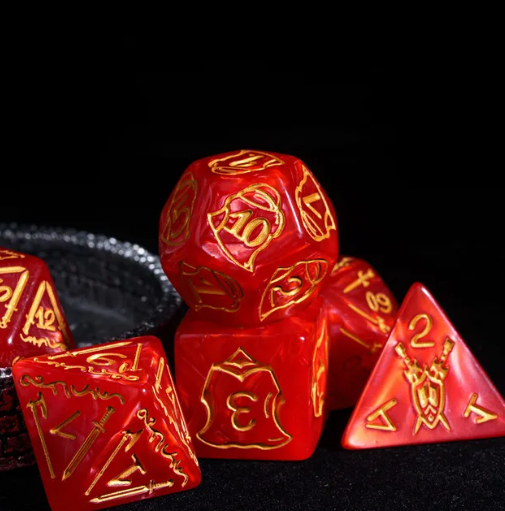 Set of red dice with gold numbering on a black background
