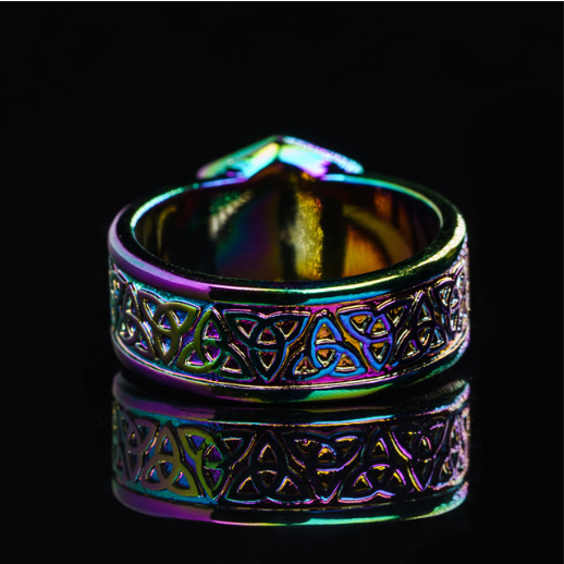 Multicolored ring with intricate design on a black background