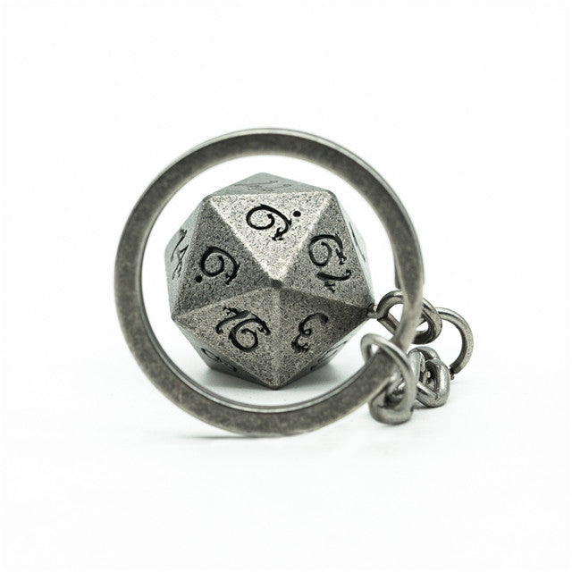 D20 polyhedral dice keychain with engraved numbers on a white background