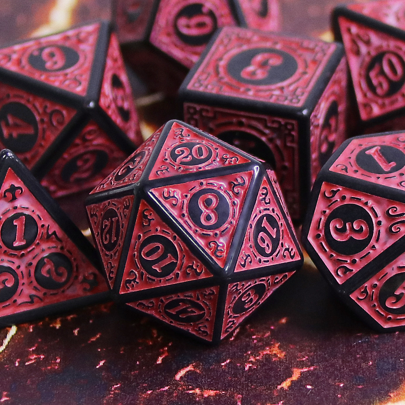 Red and black polyhedral dice set on a dark background