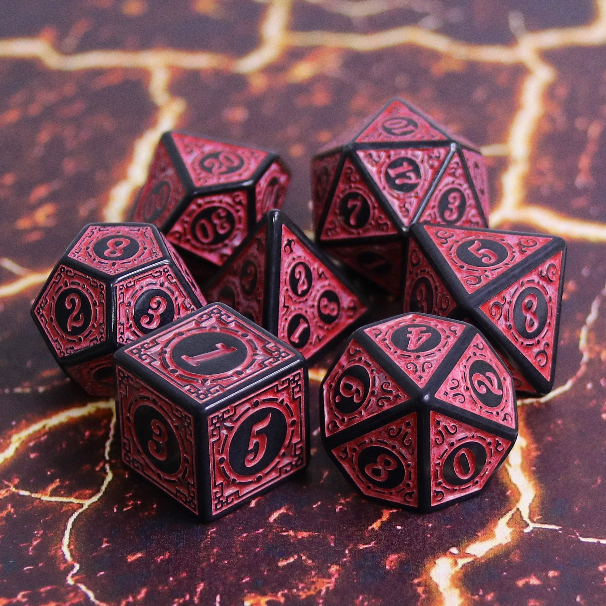 Set of red and black polyhedral dice on a fiery background