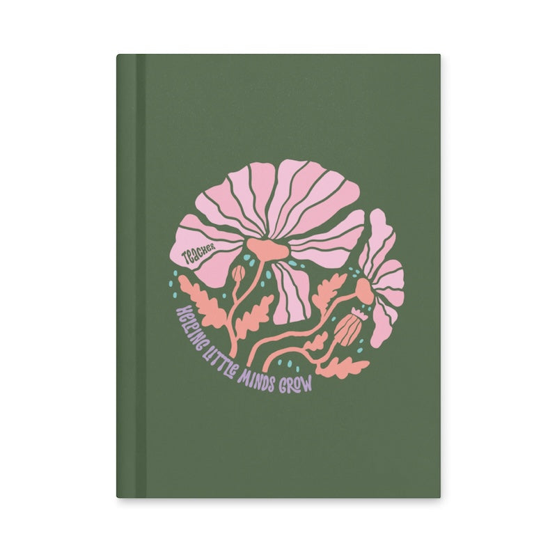 Green notebook with pink floral design and text on a white background