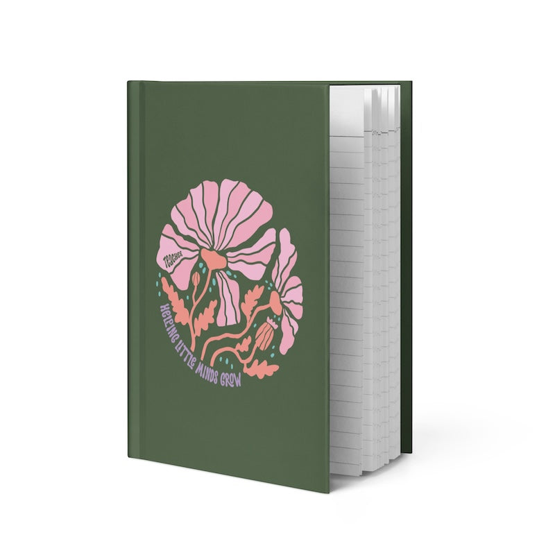 Green notebook with a pink and orange design on the cover