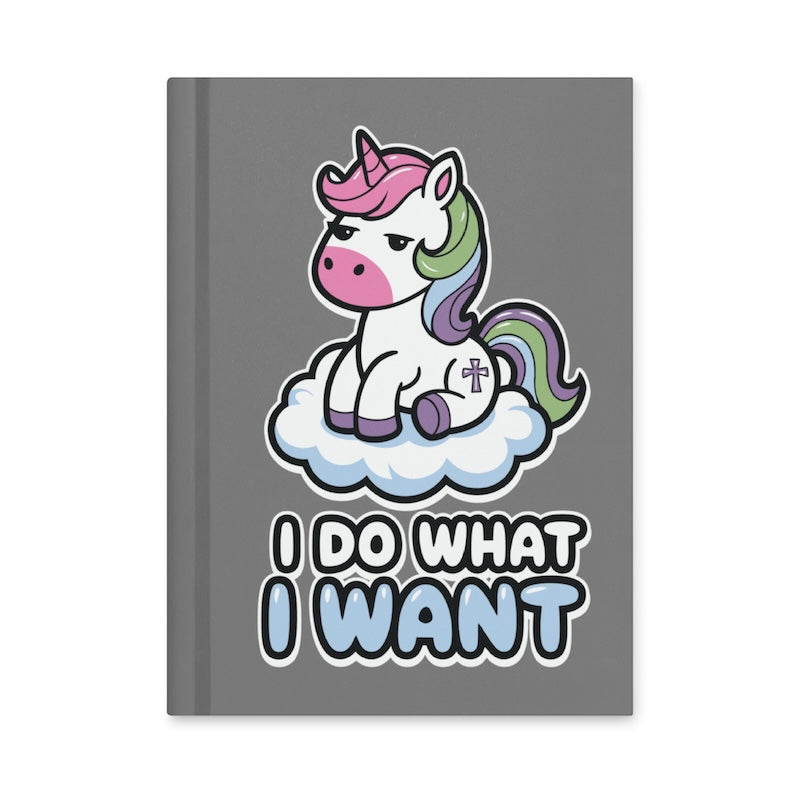 Notebook with a unicorn design and 'I Do What I Want' text on a gray background