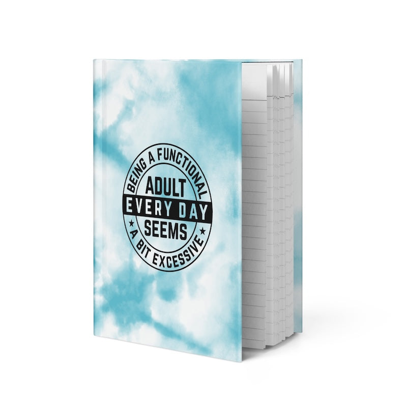 Notebook with a cloud pattern and humorous text on the cover