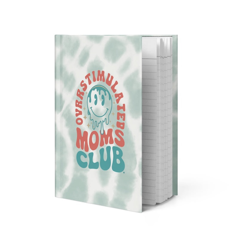 Notebook with 'Overstimulated Moms Club' design on a white background