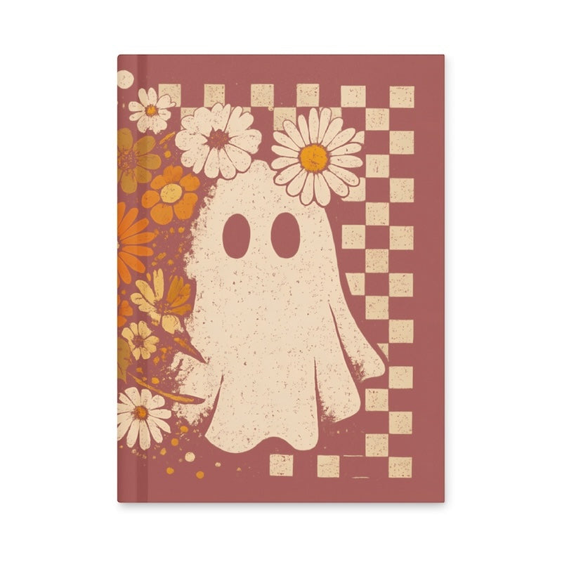 Notebook with a ghost and floral design on a red background