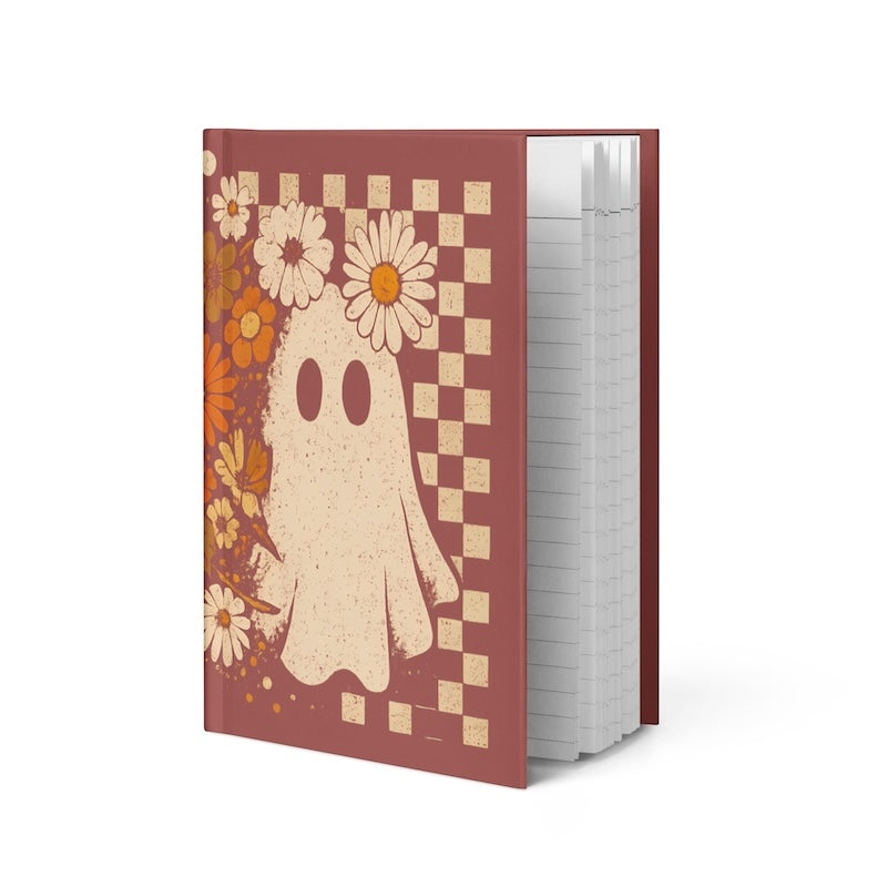 Notebook with a ghost design on a checkered background