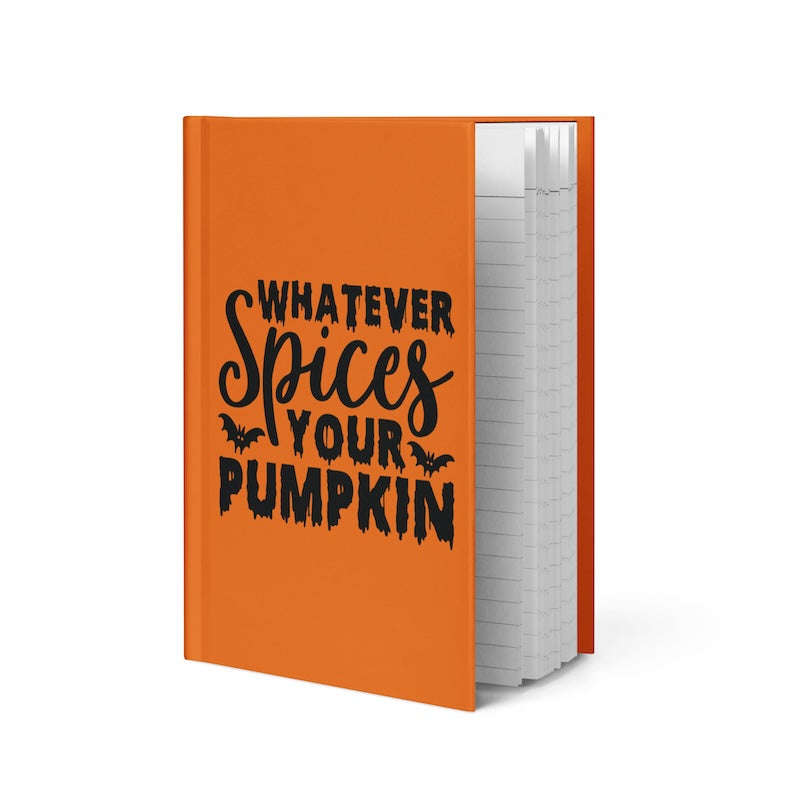Orange notebook with black text 'Whatever Spices Your Pumpkin' on a white background