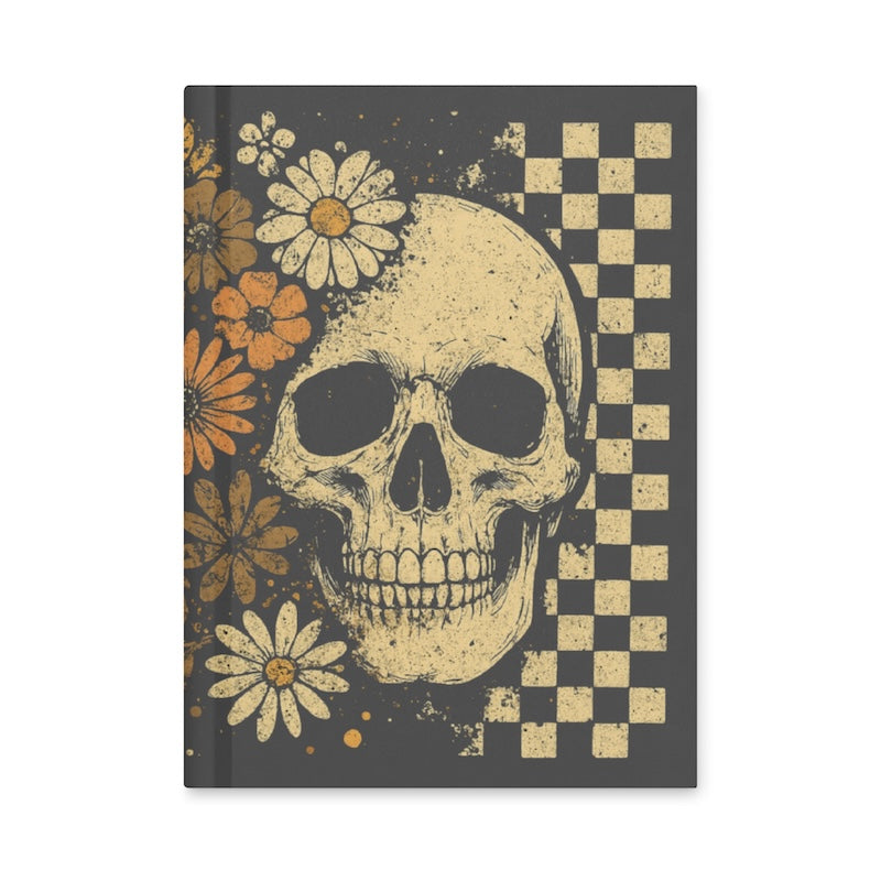 Notebook with a skull and floral design on a checkered background