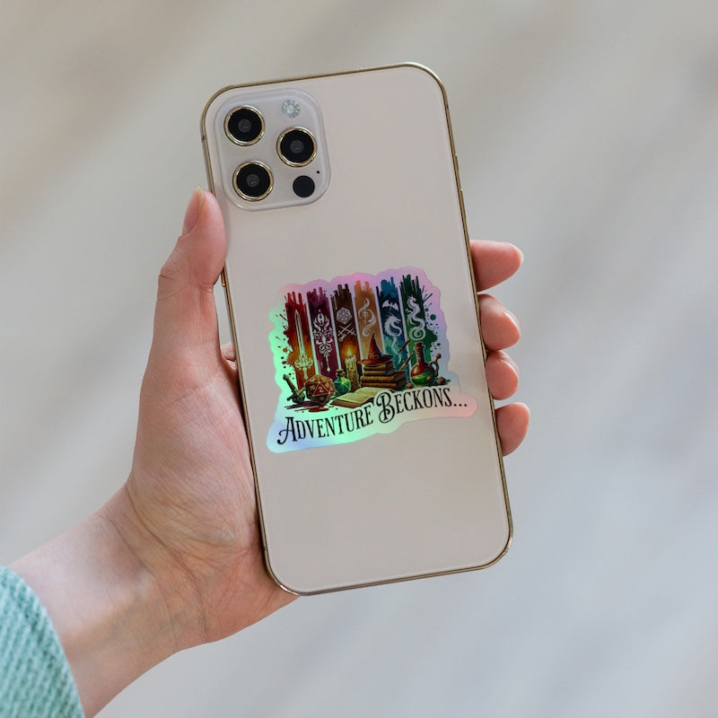Phone case with 'Adventure Beckons' design held by a hand against a neutral background