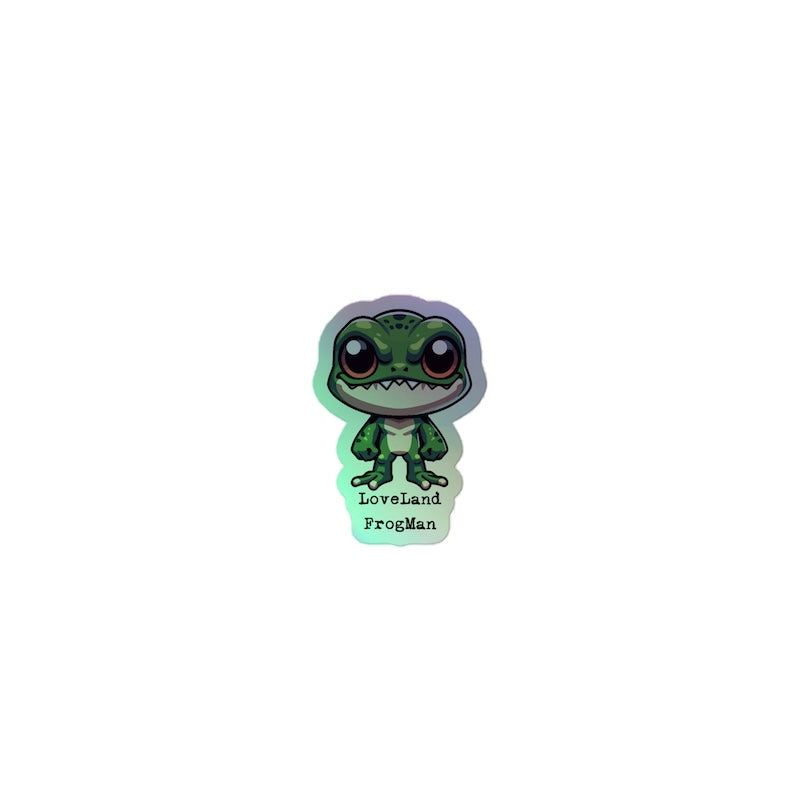 Glowing green figurine of a frog-like creature with 'Loveland FrogMan' text on a white background