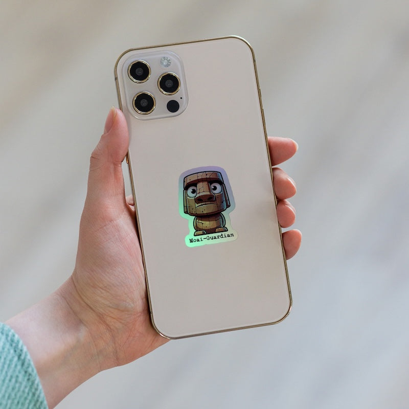 Hand holding a phone with a sticker on the back