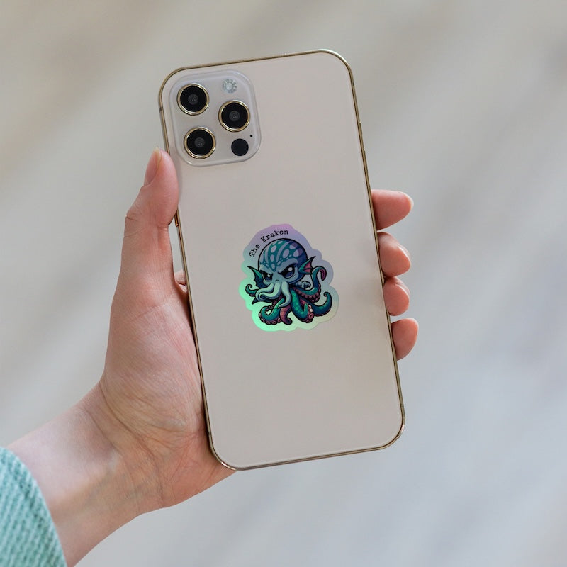 Phone case with a colorful octopus design held by a hand against a neutral background
