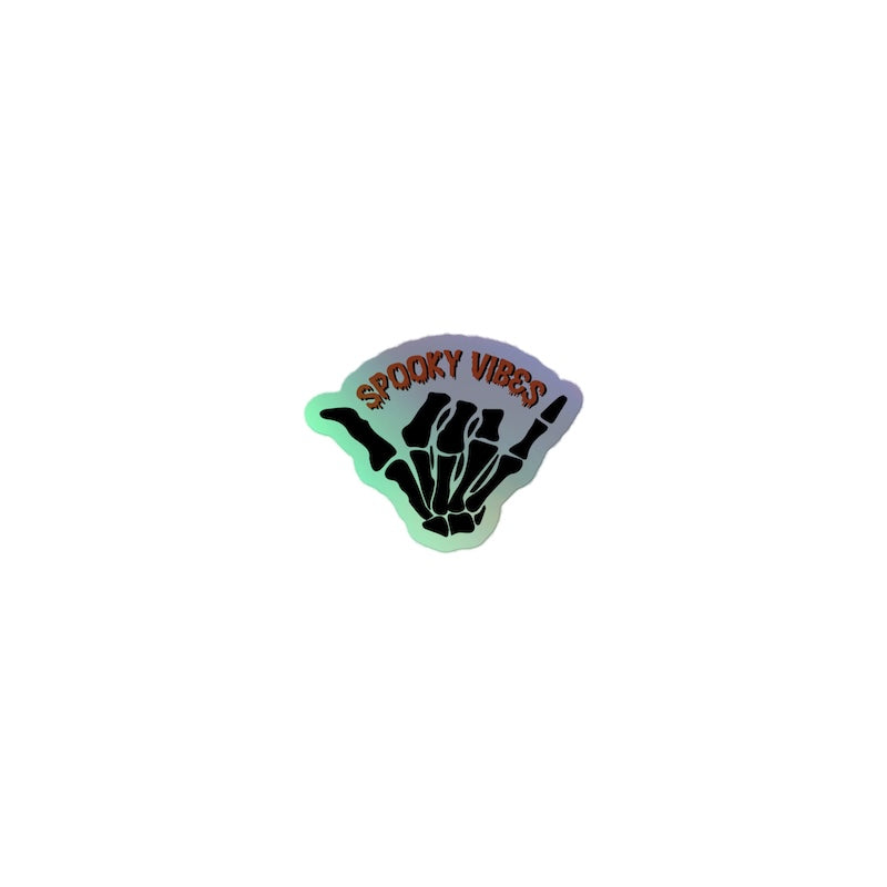 Sticker with 'Spooky Vibes' text and skeleton hand design on a white background