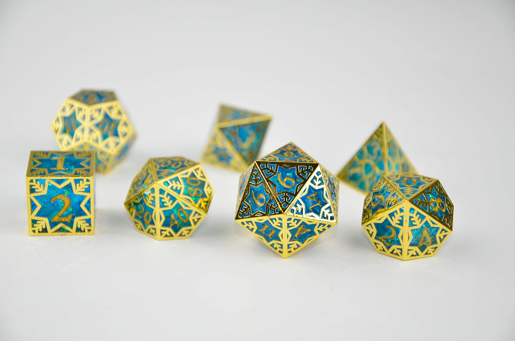 Gold and blue polyhedral dice on a white background