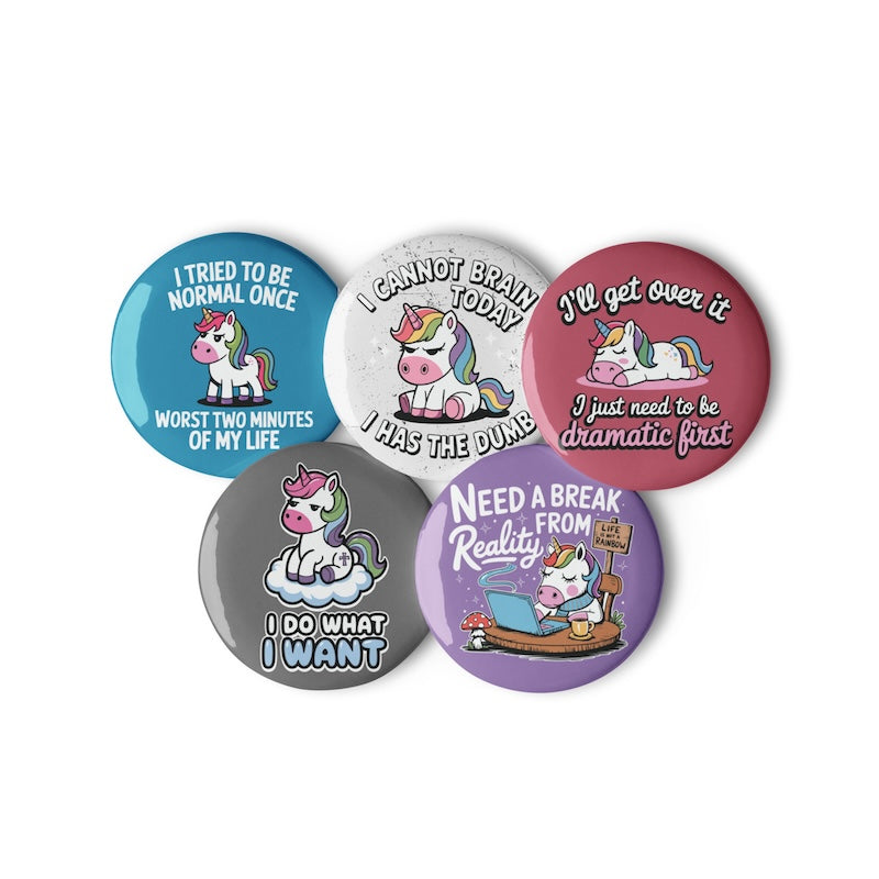 Five buttons with unicorn illustrations and humorous text on a white background