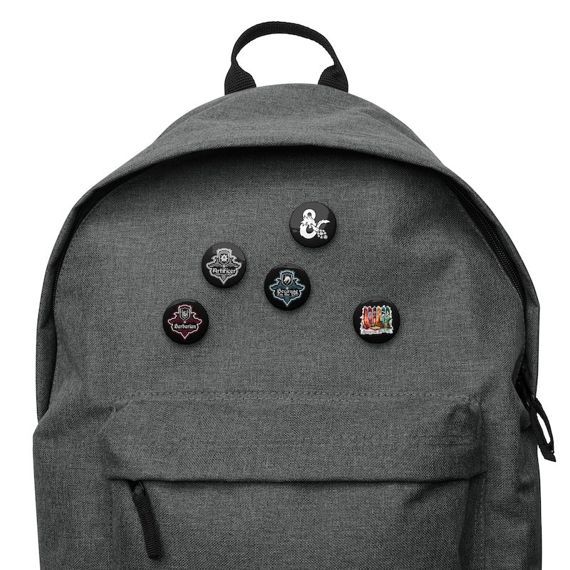 Gray backpack with five pins on a white background